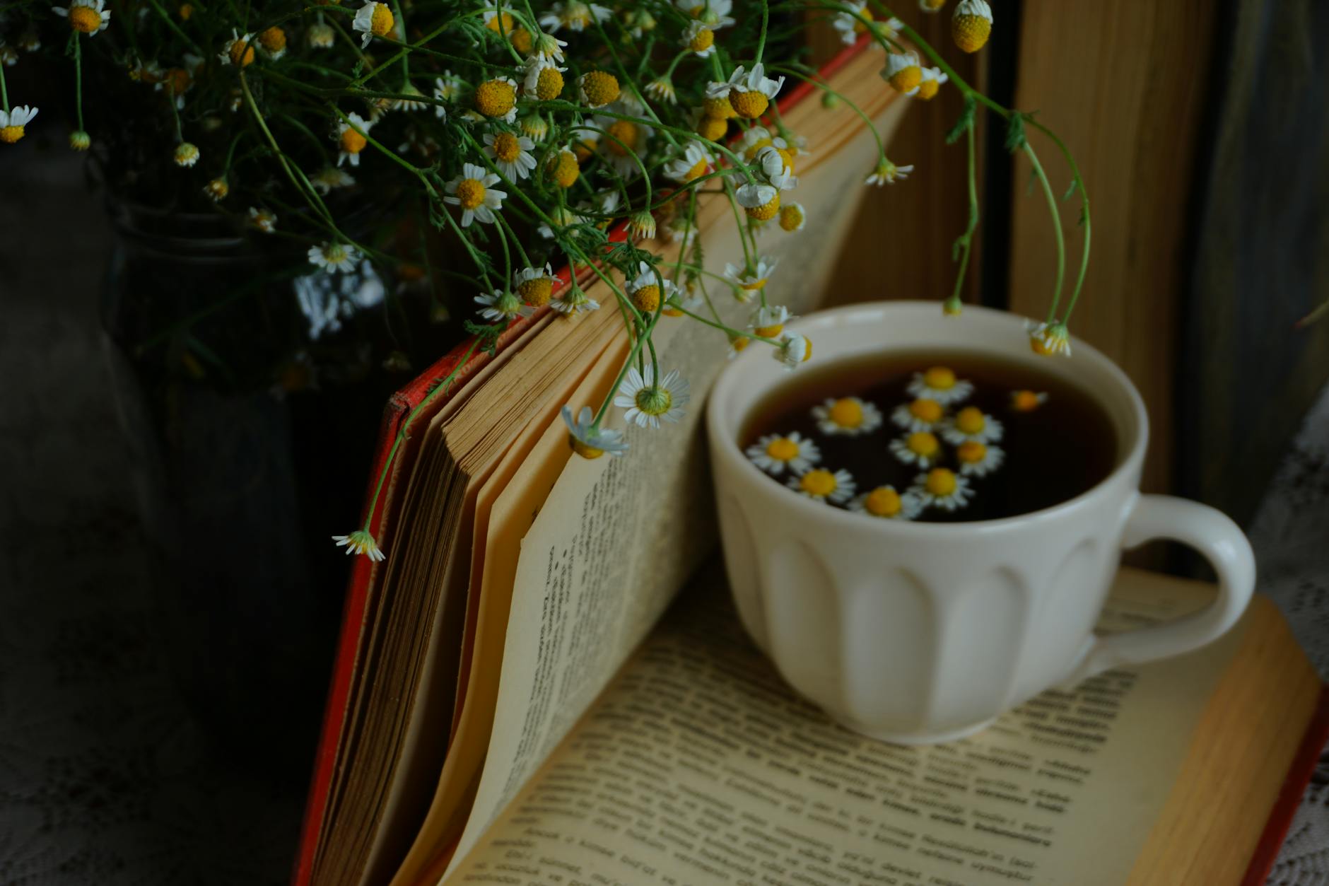 flowers and petals in tea on cup Happy Tea: Uplifting Herbs for the Winter Blues