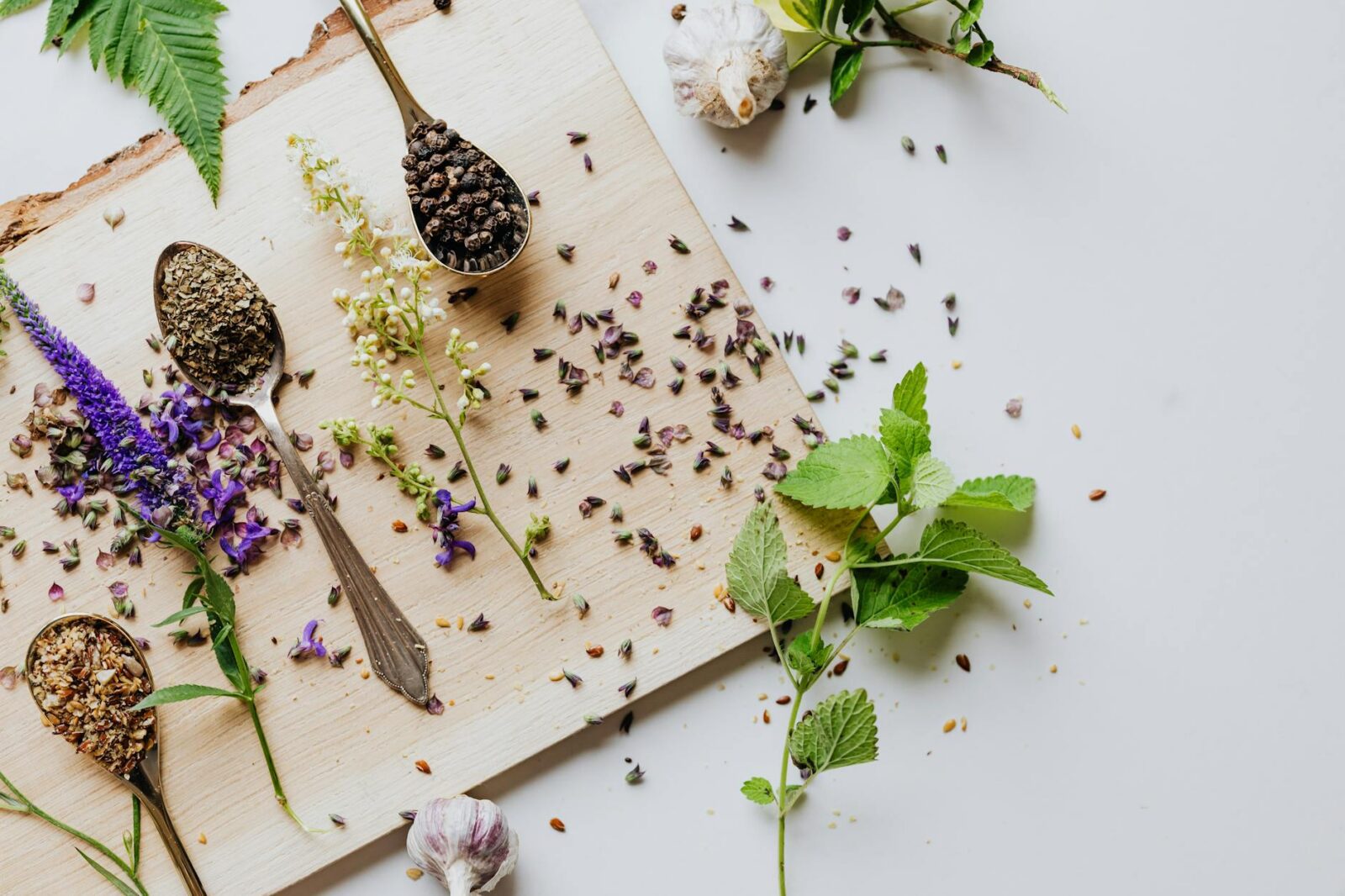 herbs and spices on brown wooden chopping board Happy Tea: Uplifting Herbs for the Winter Blues