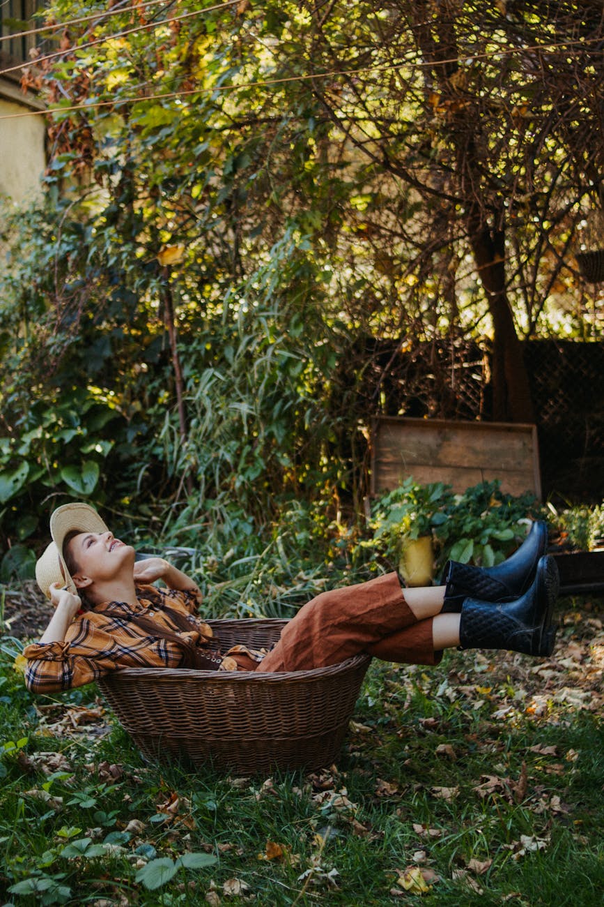 Gardening in the Fall: 30 Projects and Tasks 7 relaxed woman lounging outdoors in autumn garden Gardening in the Fall: 30 Projects and Tasks