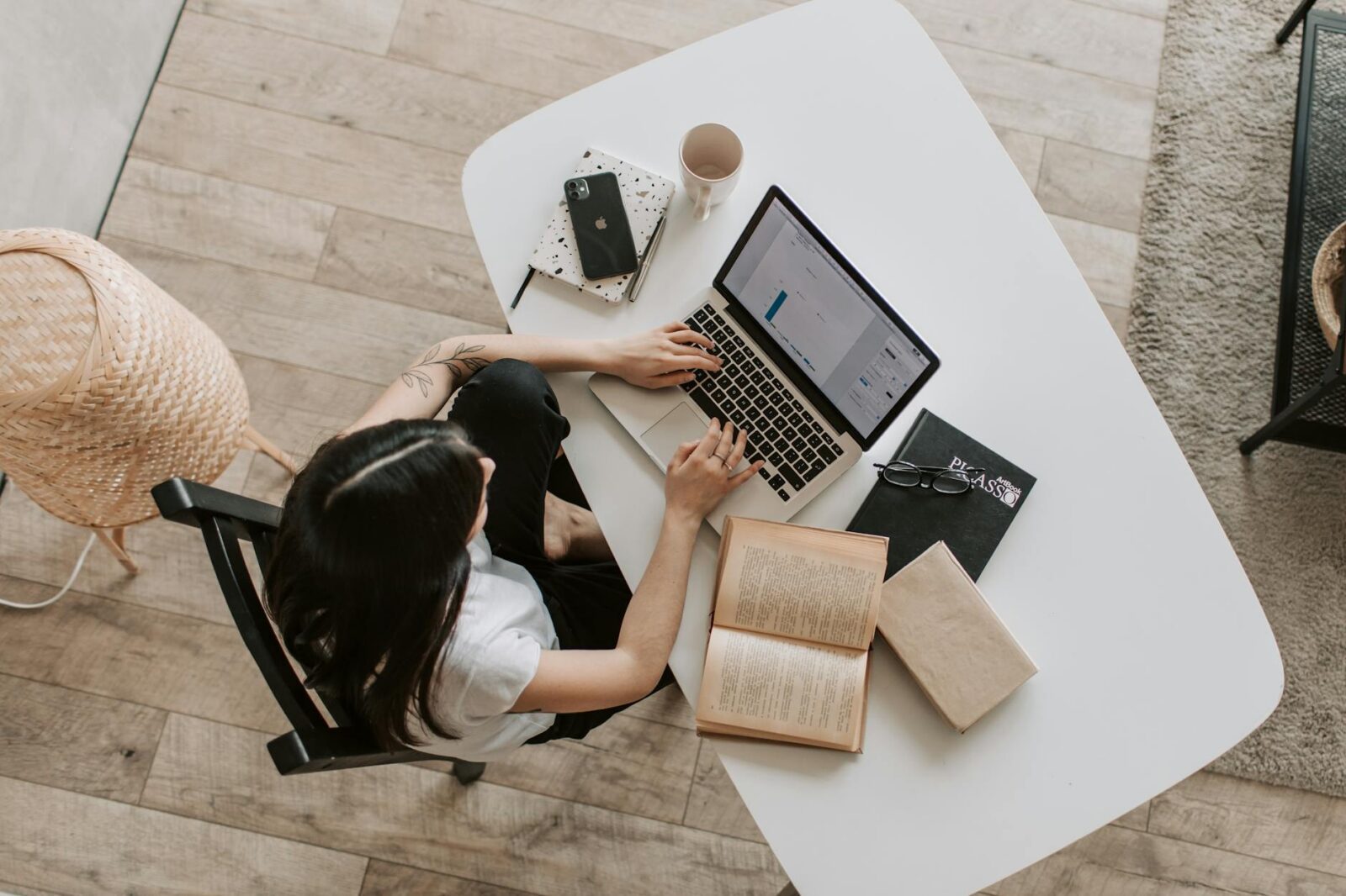 young lady typing on keyboard of laptop in living room Blog Article Categories Career