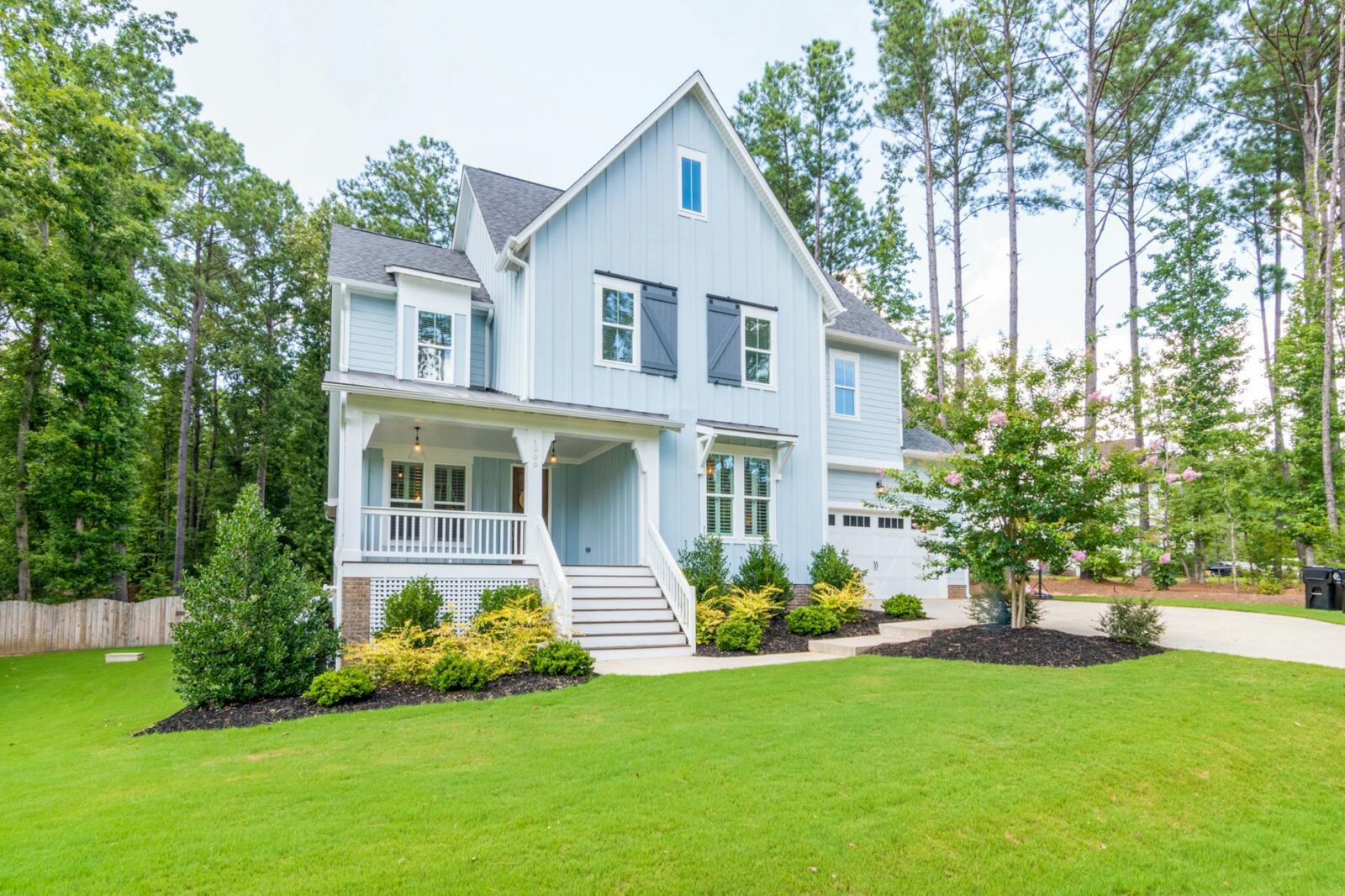 blue house on green lawn