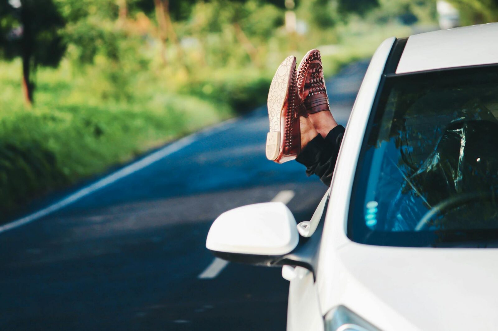 person wearing pair of brown leather loafers Vacation Planning Tips for Stress Free Travel