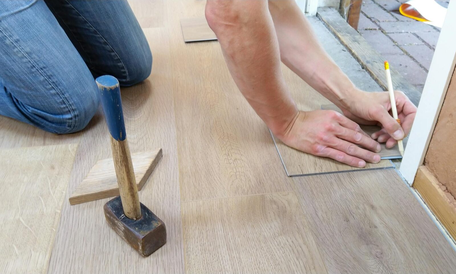 person holding pencil 7 Easy Home Upgrades to Enhance Your Listing