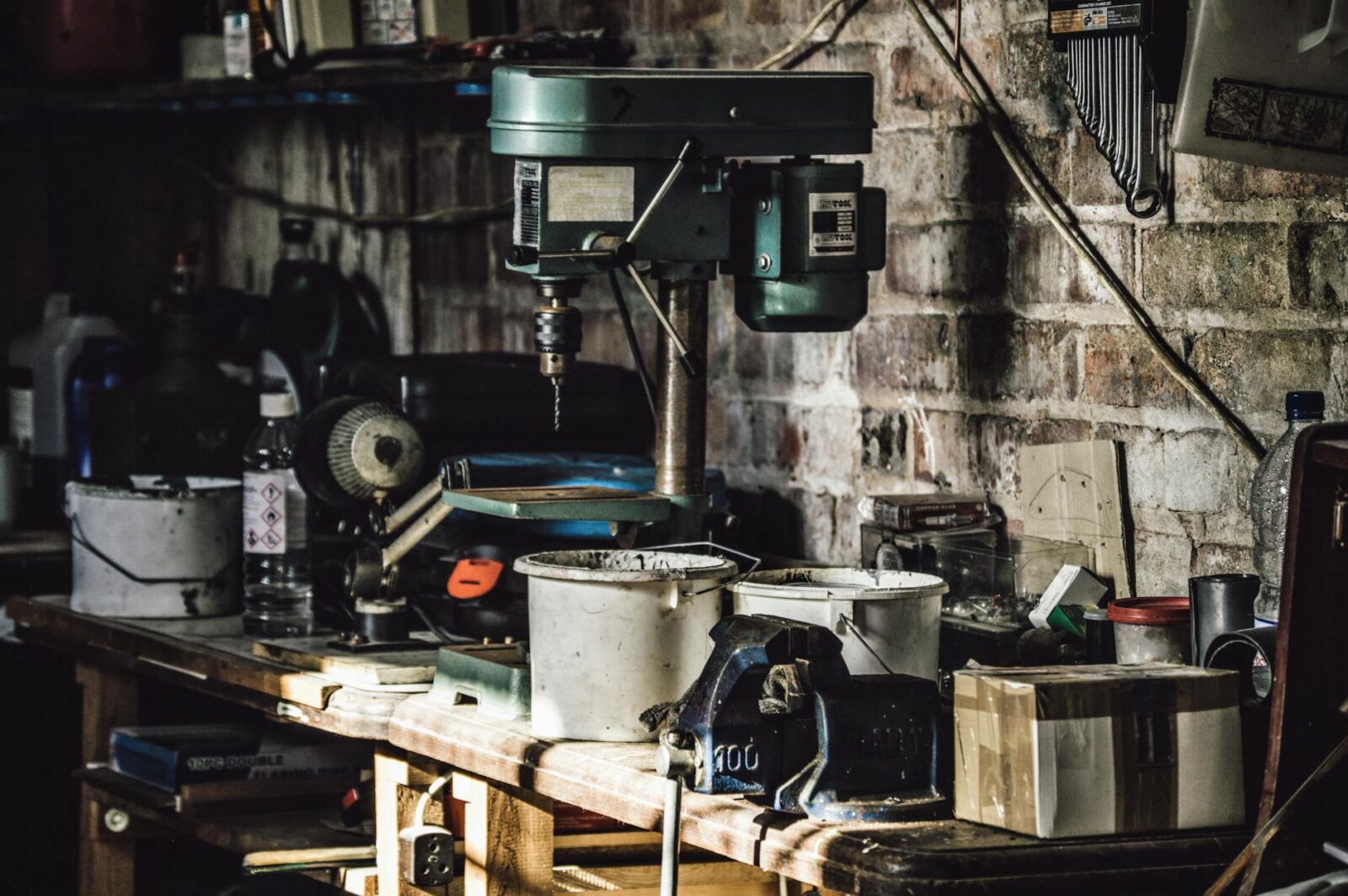 green and white press drill on table Top 7 Biggest Sources of Household Clutter (and how to fix them!)