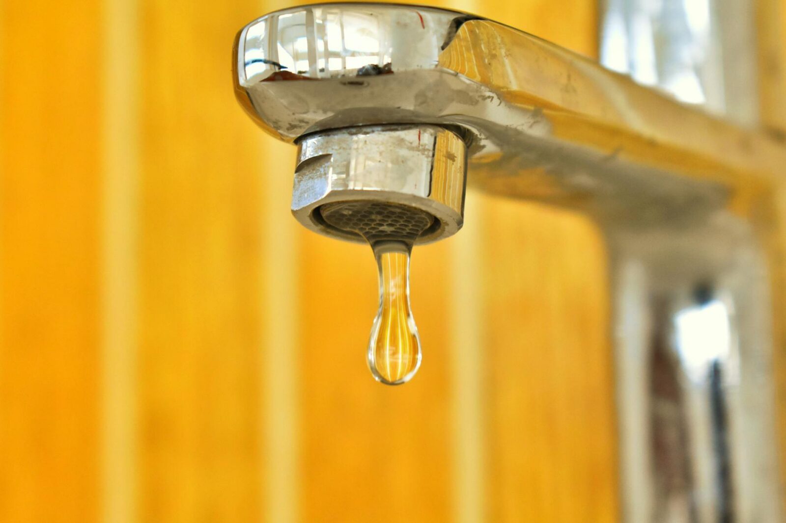 close up photo of water drop Urgent Home Repair Warning Signs You Shouldn’t Ignore