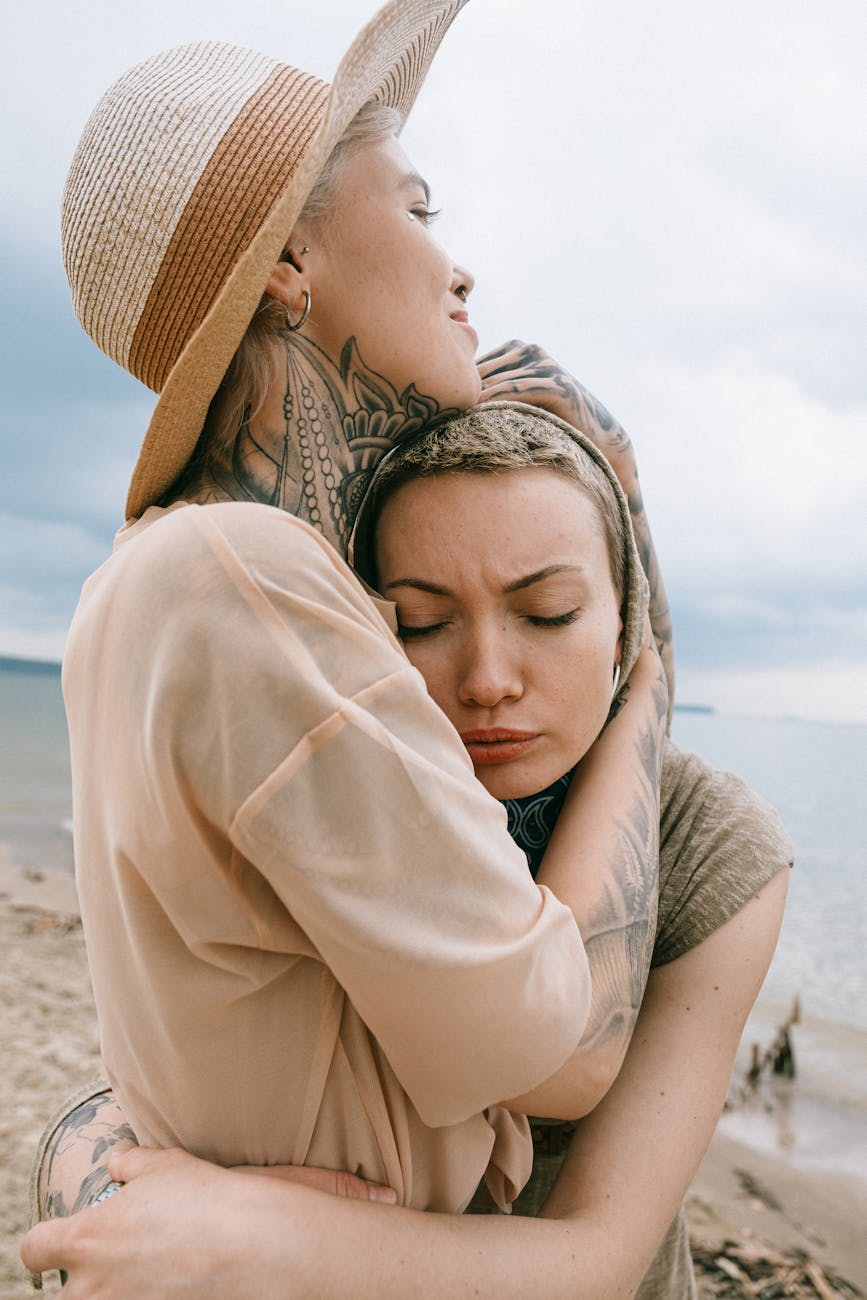woman comforting friend The Best Strategies For Dealing With Loss