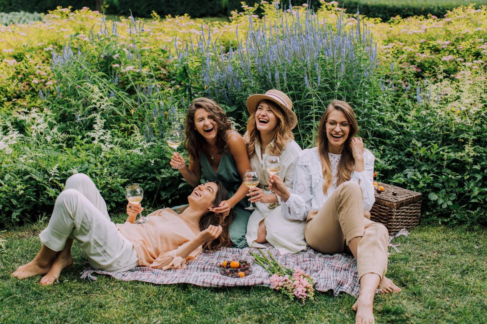 women sitting on green grass field How to Boost Self Confidence