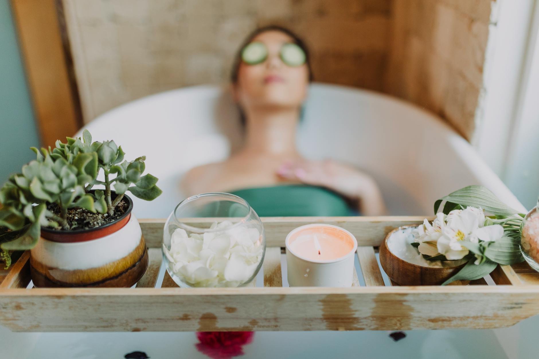 woman in green tube top sitting on white ceramic bathtub 10 Ways to Prep Your Vacation Rental Property for Guests