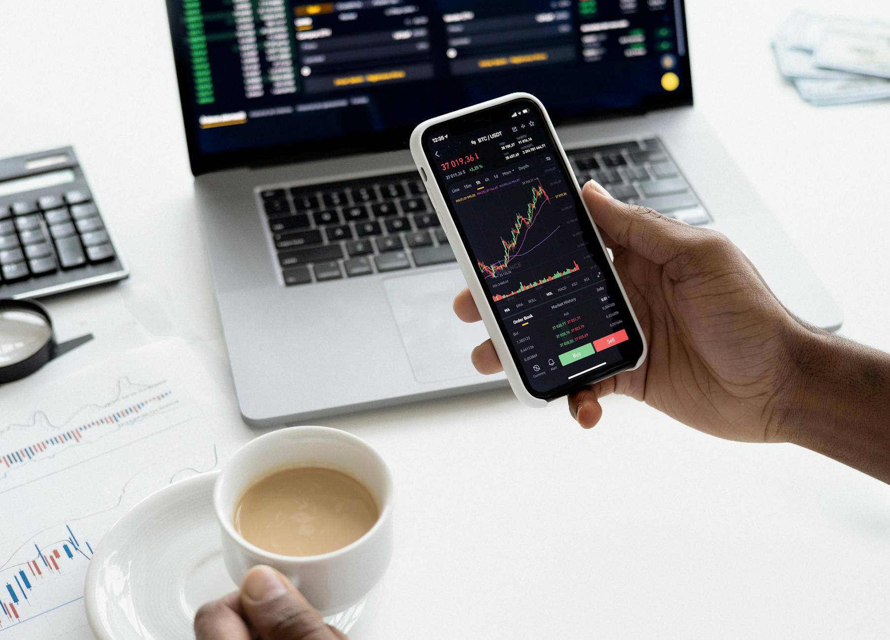 person holding a smartphone The Ultimate Guide to Financial Independence