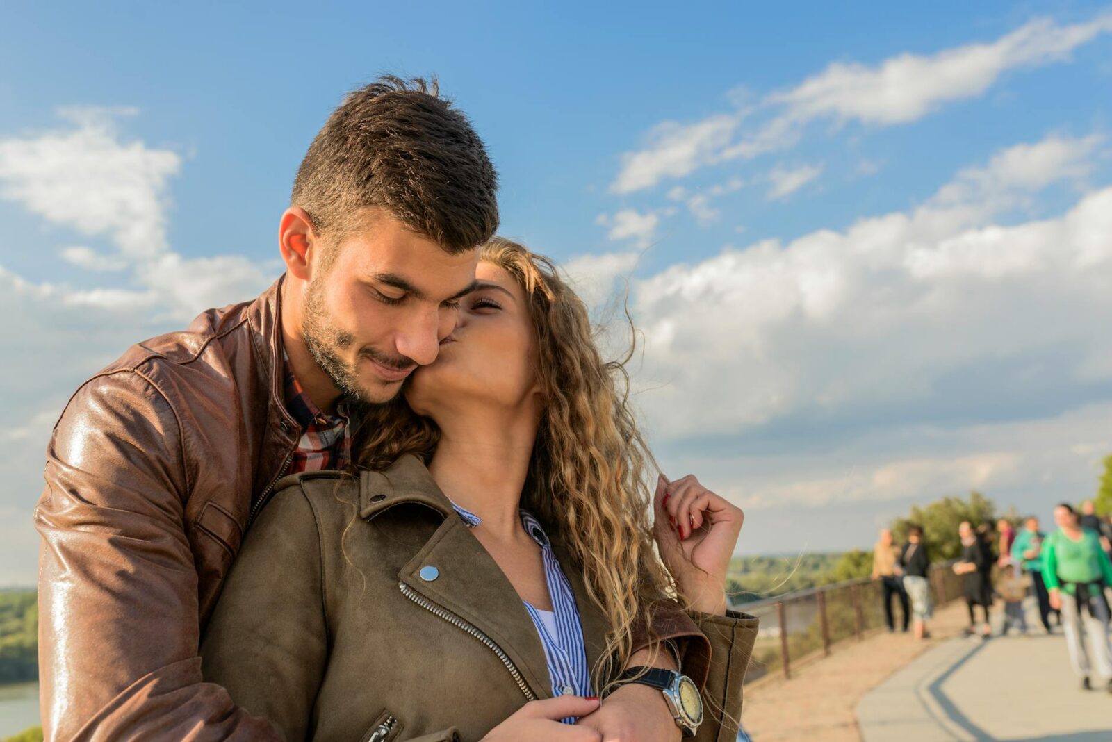 woman kissing man The Biggest Life Milestones You Will Experience in Adulthood