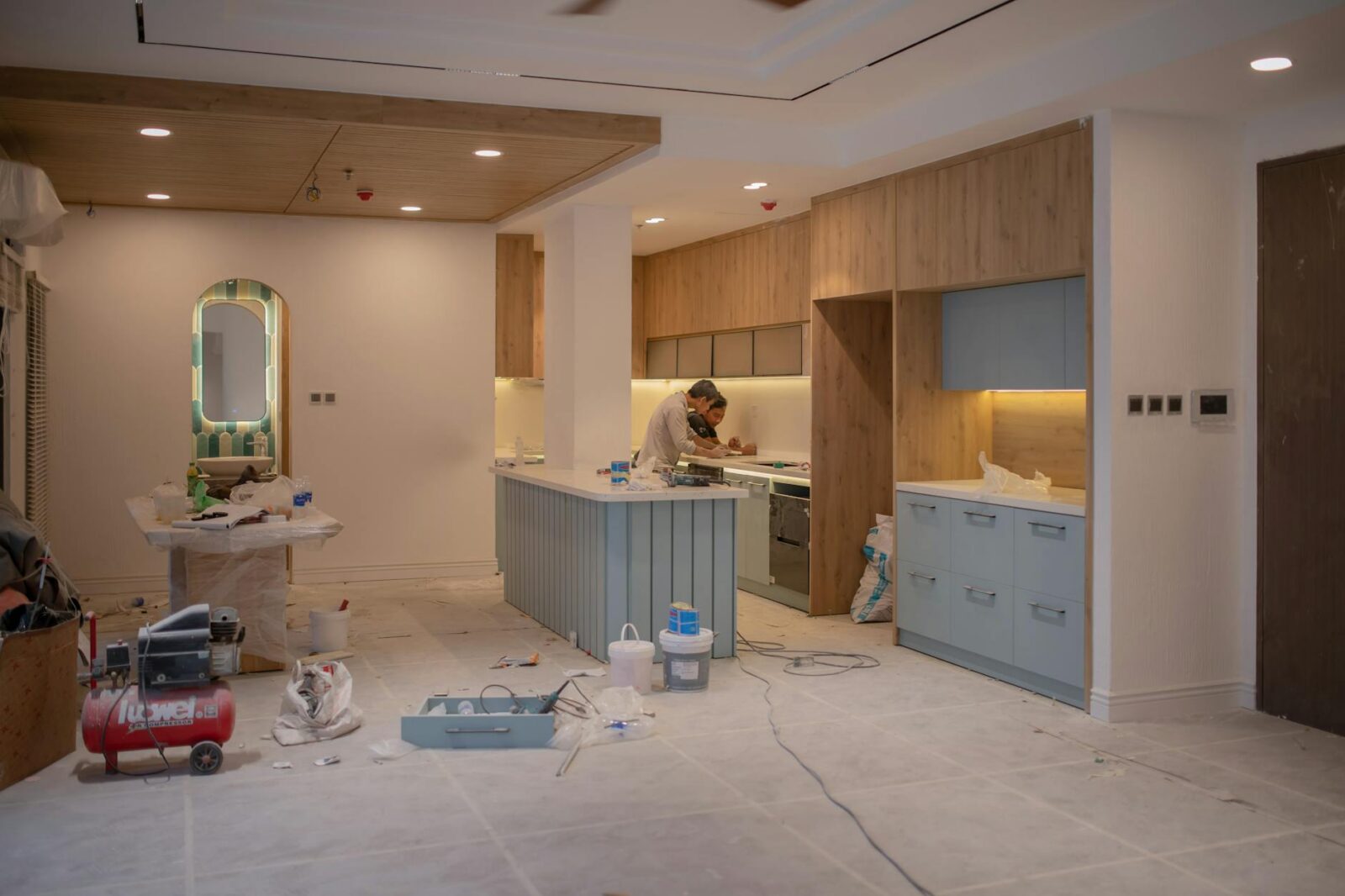men working inside a house under repairs Why Building Your Own Home Is Achievable and Affordable