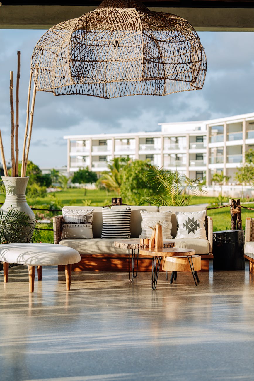 sofa and table on terrace Profitable Real Estate Investment Strategies: Tools, Tech, and Resources