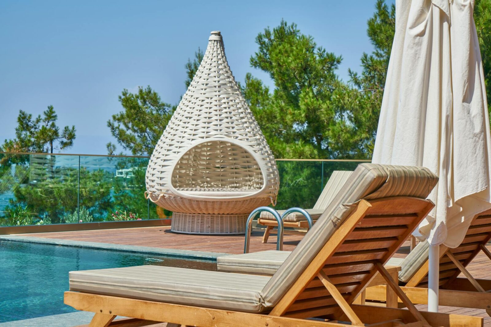 sun loungers on the deck The Ultimate Guide to Indoor/Outdoor Living Spaces