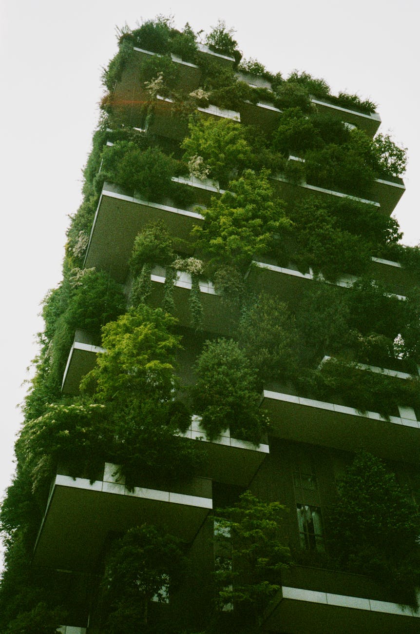 white building exterior surrounded trees and gardens Profitable Real Estate Investment Strategies: Tools, Tech, and Resources