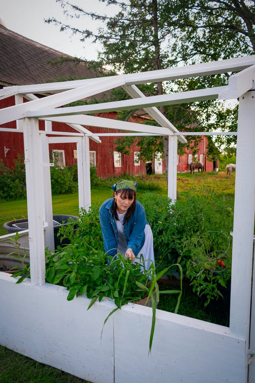 portrait of woman gardening on a wisconsin farm Farm Layout Ideas: Site Plan Designs for Your Homestead