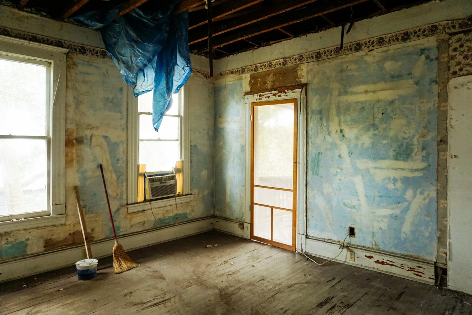 brown broom and white plastic bucket Profitable Real Estate Investment Strategies: Tools, Tech, and Resources