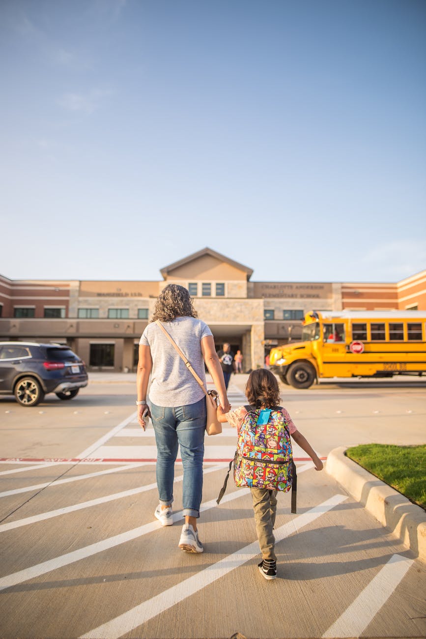 anonymous mother leading daughter to school in city 5 Key Questions To Ask Before Embarking On A New Career