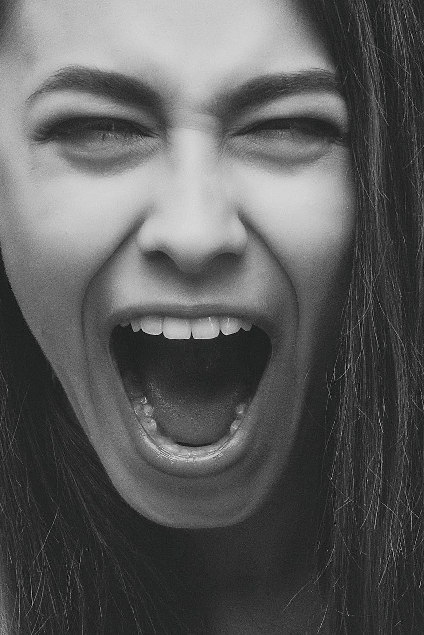 grayscale photo of person screaming How to Manage Stress When You Hit Rock Bottom