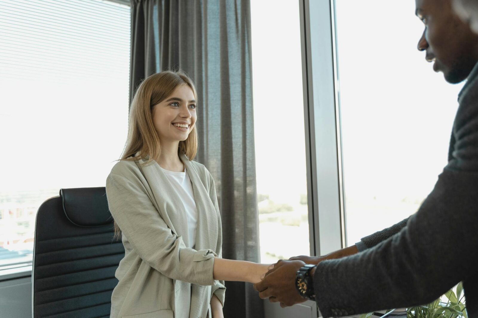 female candidate doing hand shakes 5 Key Questions To Ask Before Embarking On A New Career