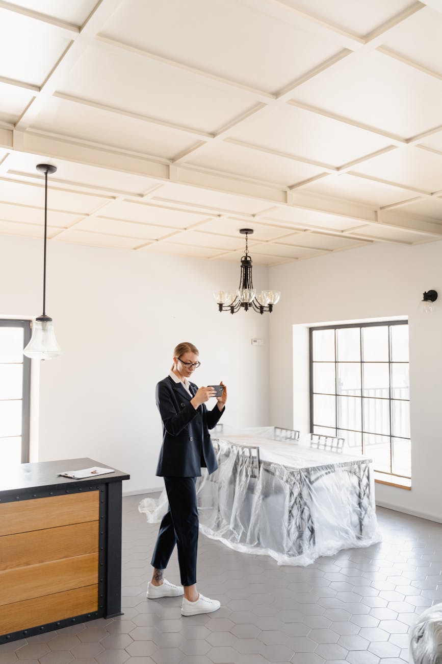 man in black suit standing beside white table New House Problems You Might Not See On Your Home Inspection