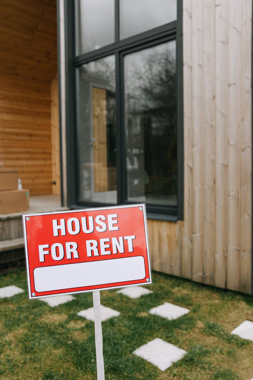 a wooden signage beside the wooden house 6 Real Estate Metrics All Pro Investors Track