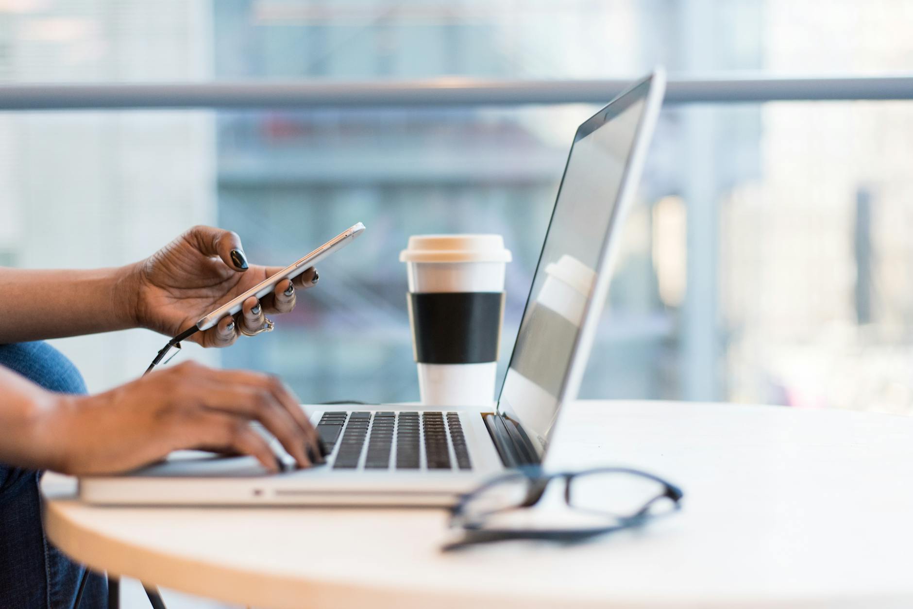 laptop on table top Top Commercial Real Estate Investment Strategies: Upgrades That Maximize ROI