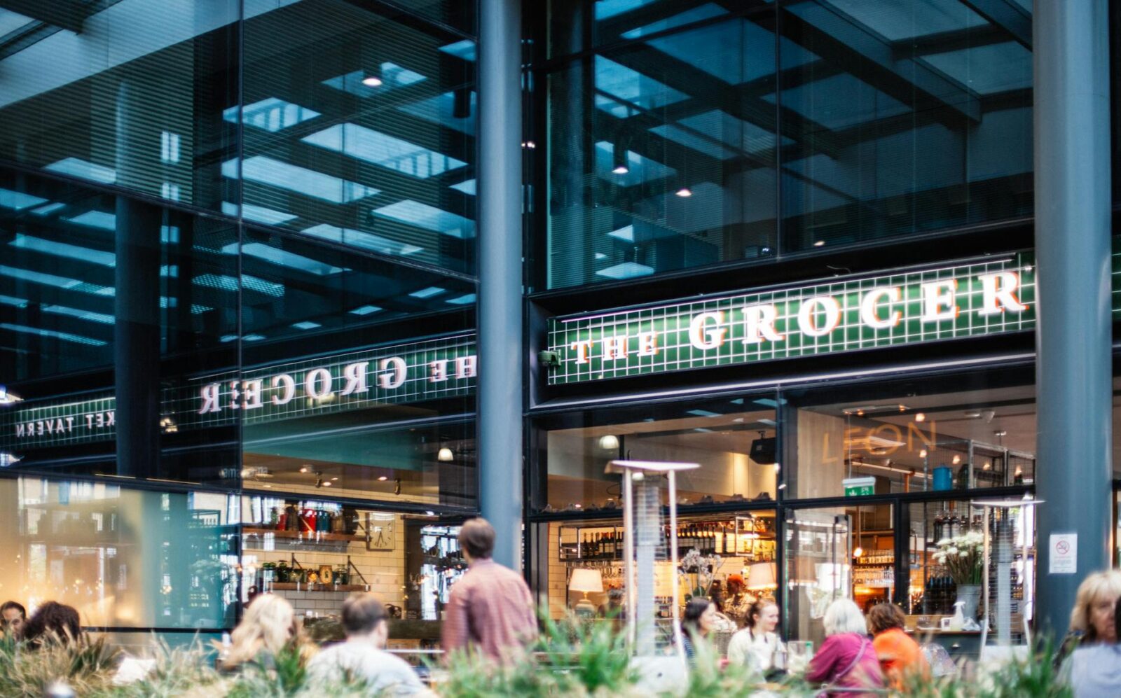 people near grocer store inside building Top Neighborhood Features to Look for When House Hunting