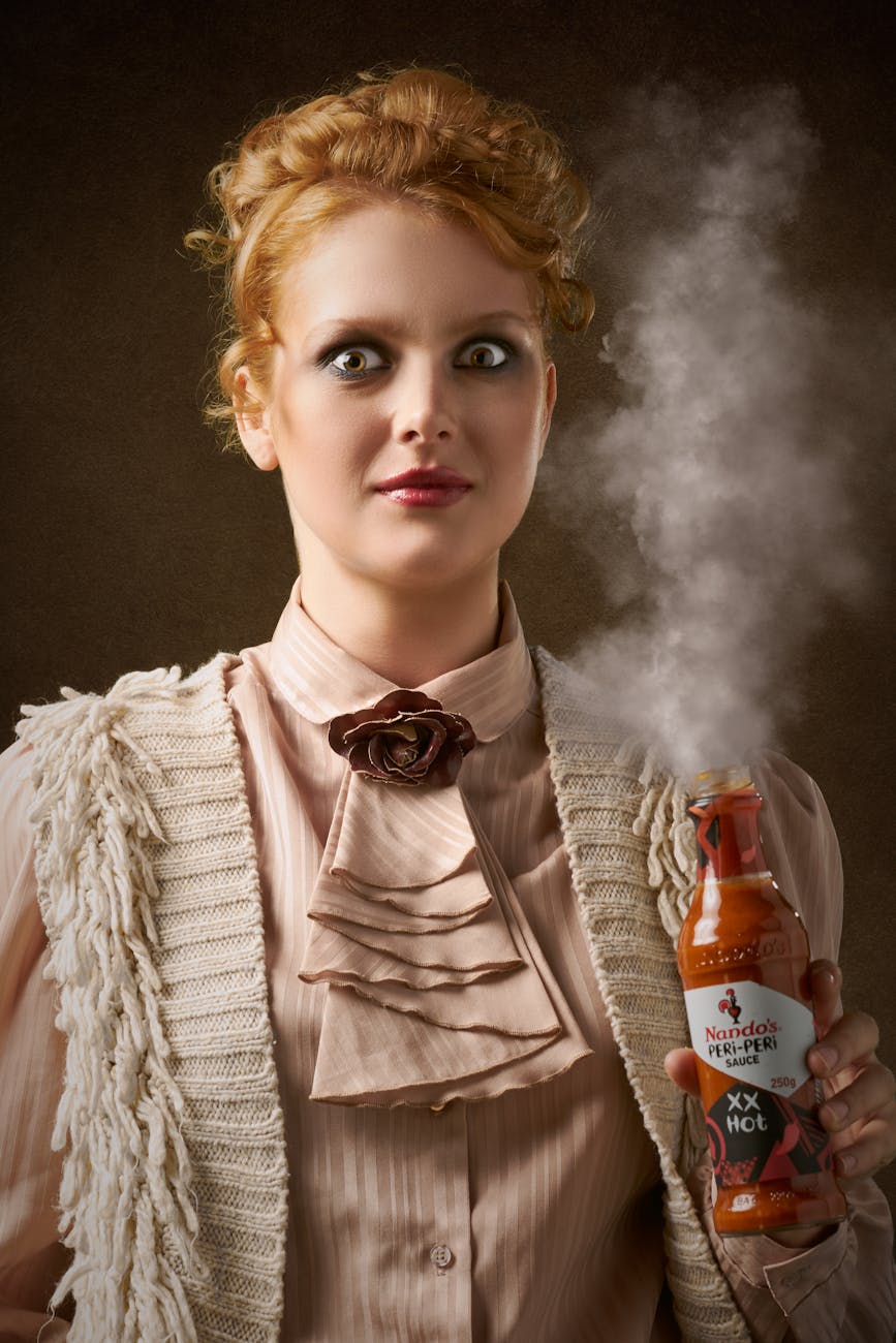 woman wearing brown shirt hot sauce 4 Easy Ways to Build Flavor in Home Cooking (Without Overcomplicating Things)