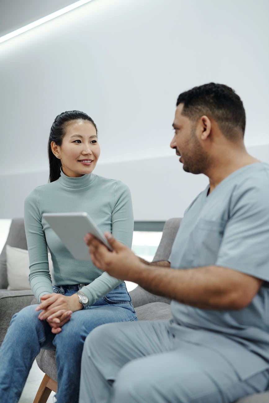 a woman talking to a doctor How To React When Health Issues Threaten Your Finances