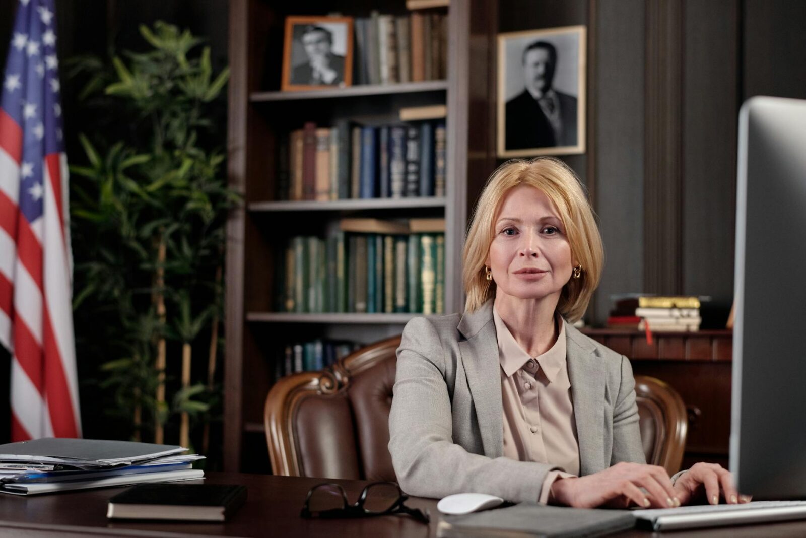 businesswoman sitting in her office 9 Times You Need A Lawyer In Your Life