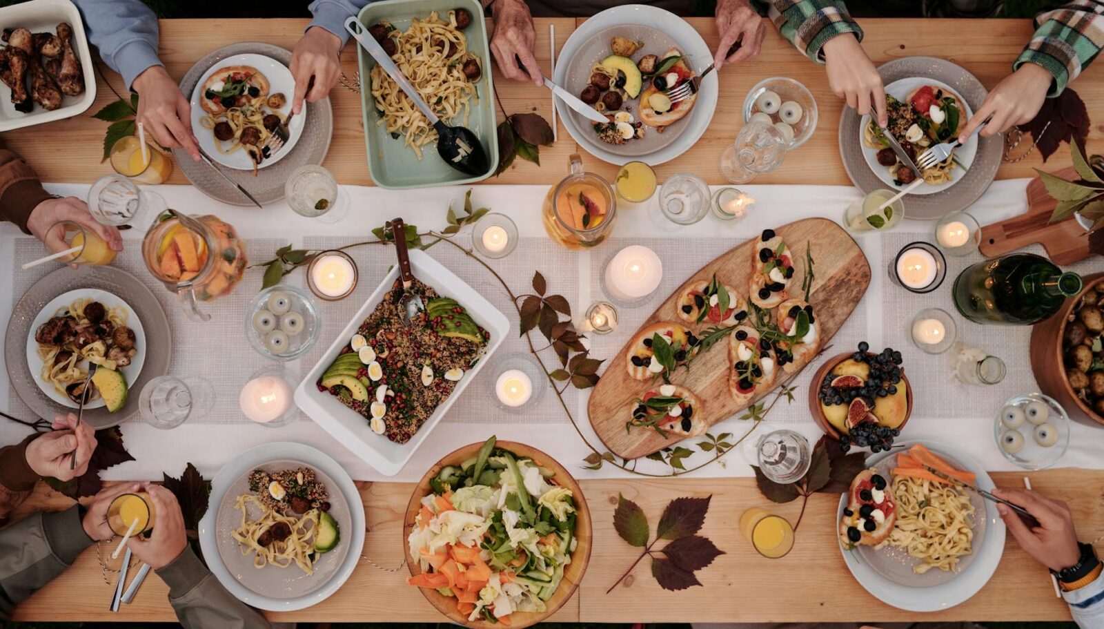 food on decorated table during party How to Set Up a Kitchen From Scratch: STR Hosts & New Homeowners