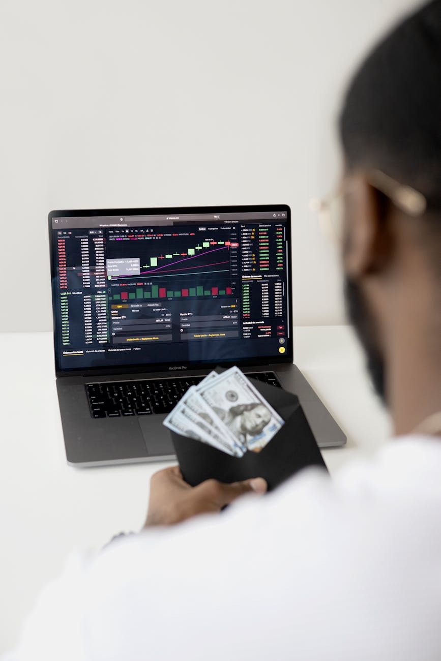 photo of man in front of laptop Unique Money Moves: Beginner-Friendly Investment Strategies That Work