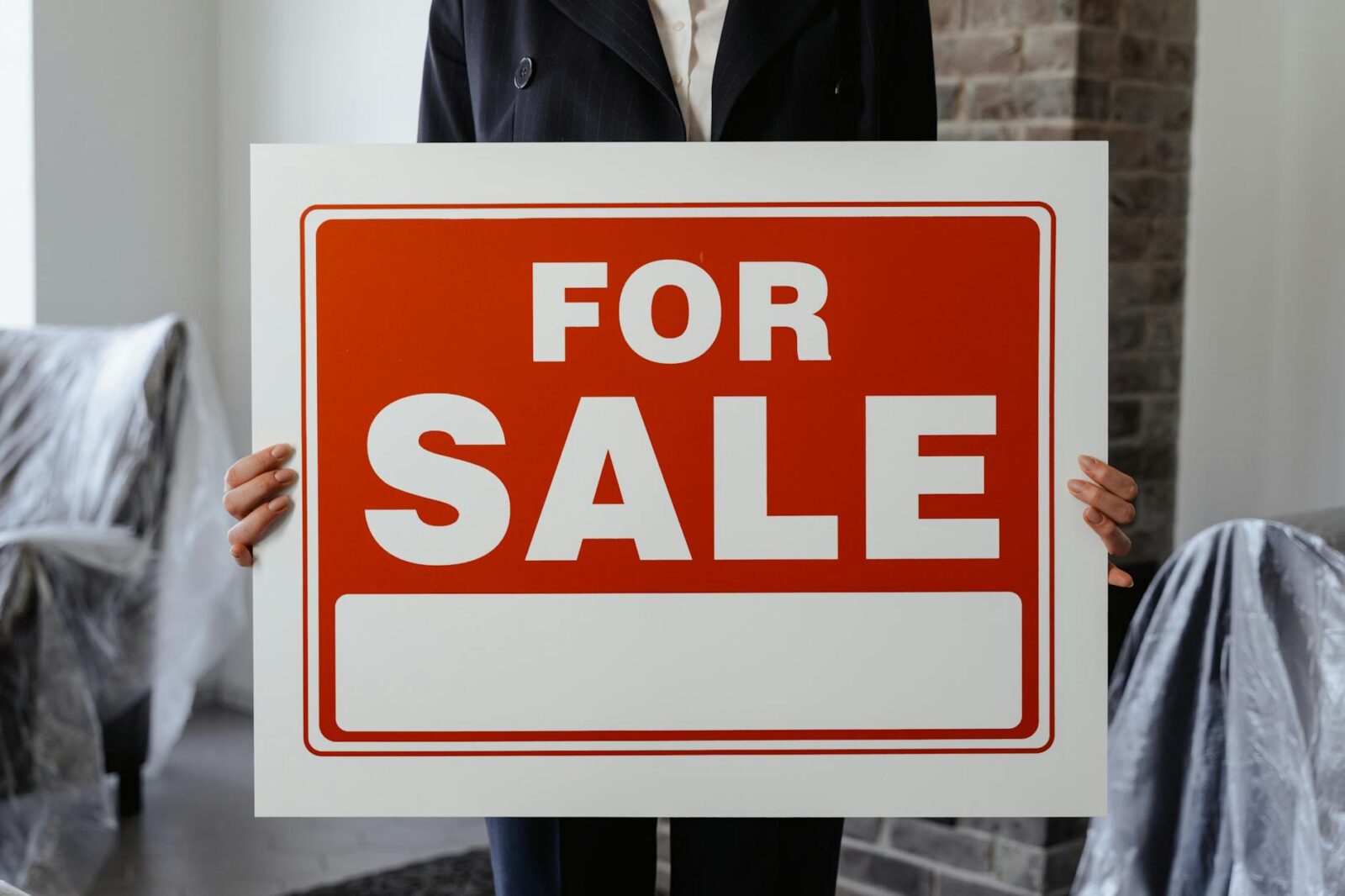 a person holding a placard