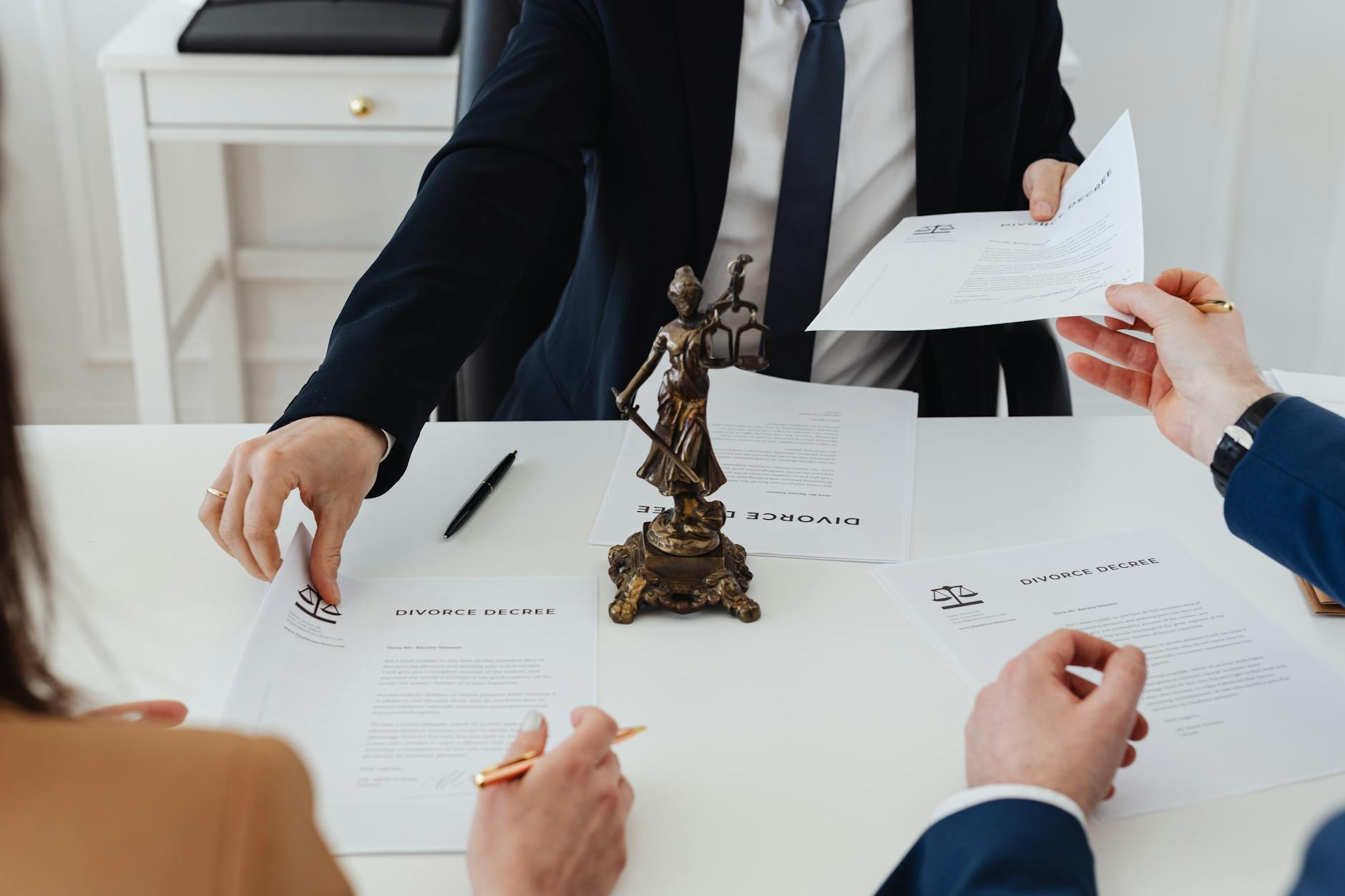 people holding divorce papers When to Hire an Attorney: Legal Guidance for Life’s Unexpected Moments