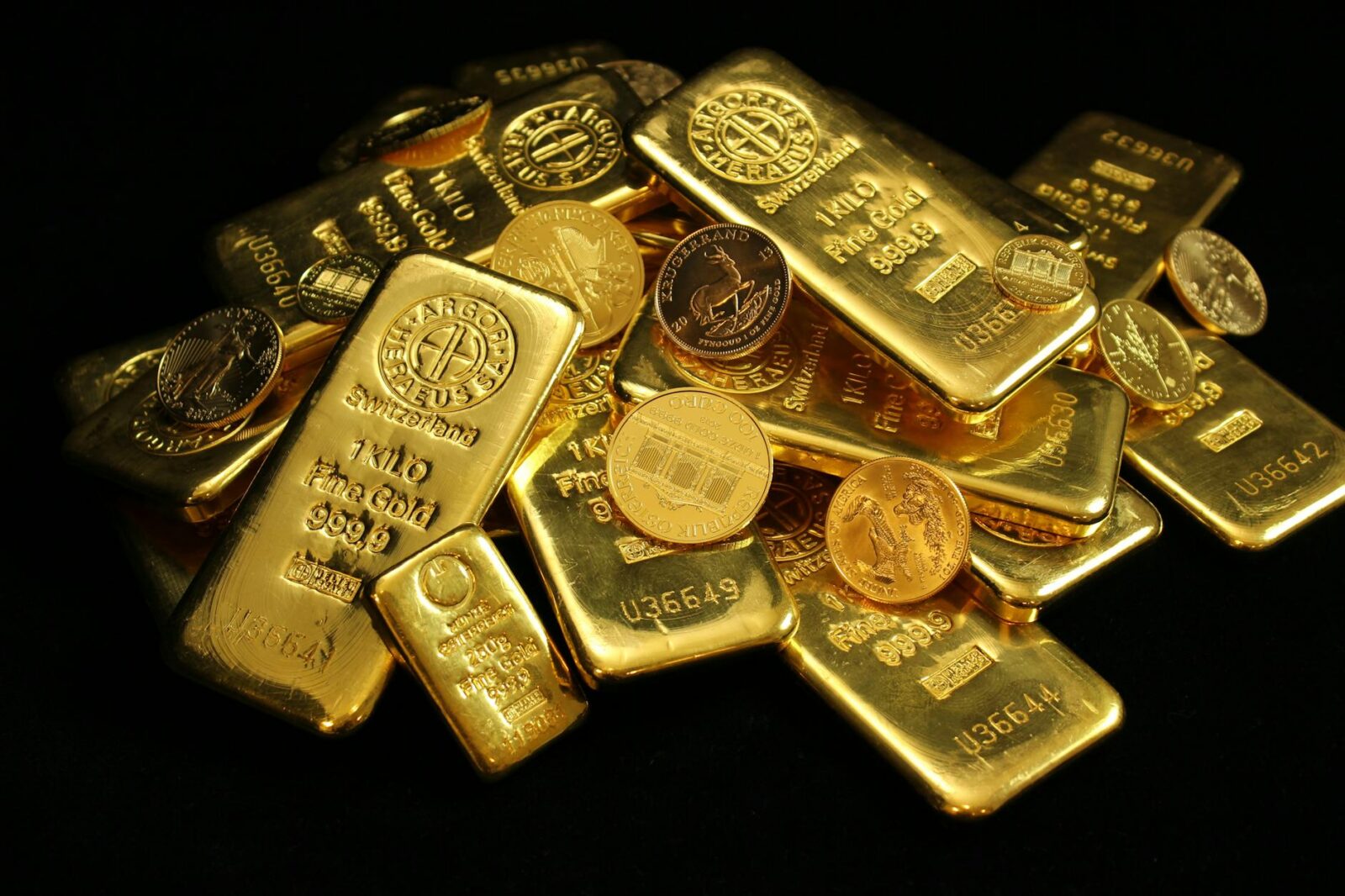 gold coins and bars on black background 9 Times You Need A Lawyer In Your Life