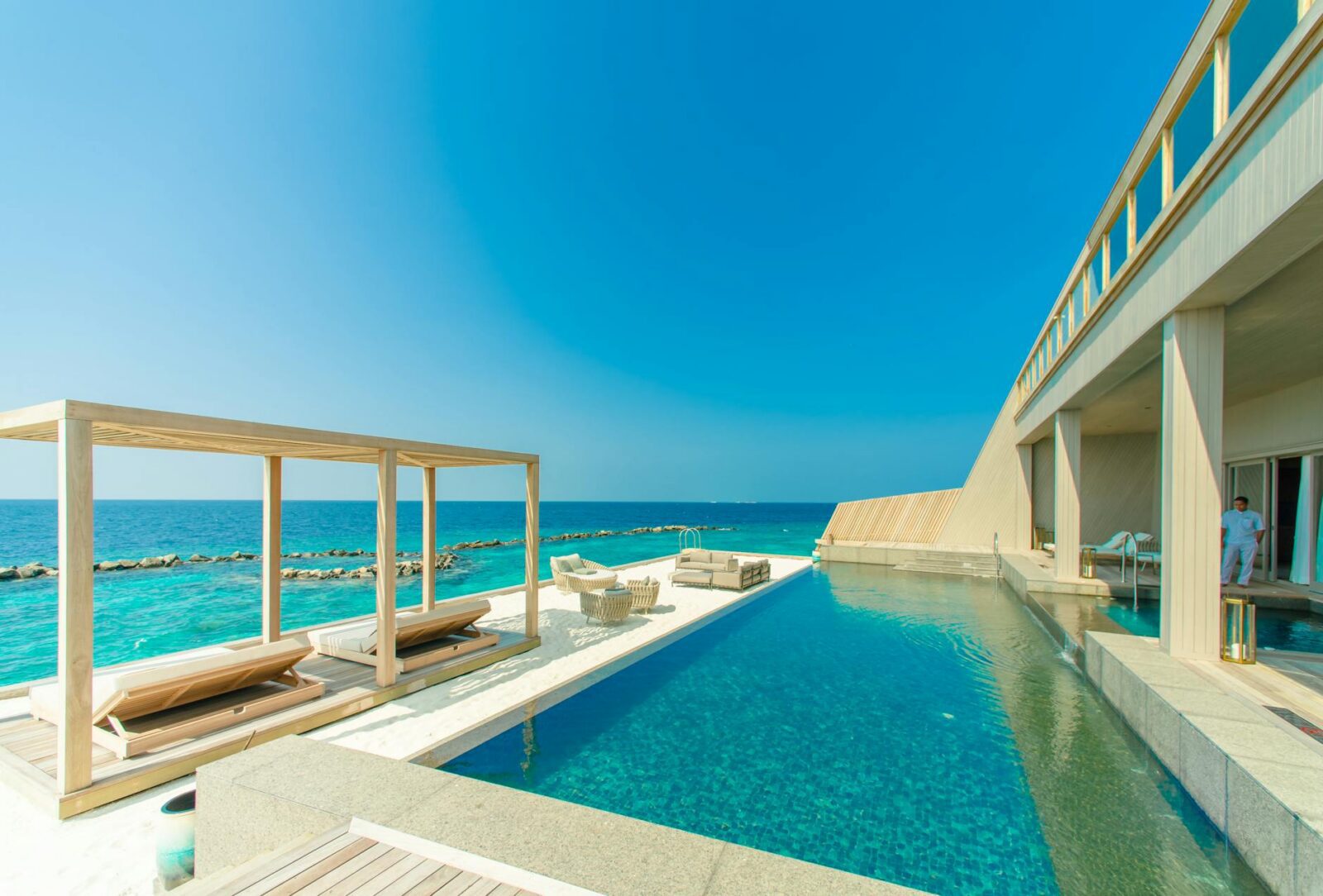 architectural photography of gray granite swimming pool and outdoor lounge at beach side Add Luxury to Your Next Vacation