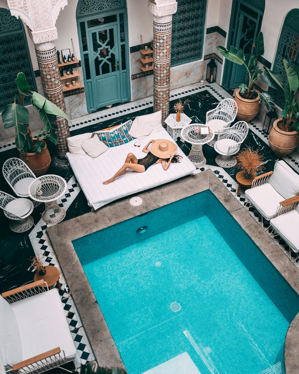 photo of person near swimming pool Add Luxury to Your Next Vacation