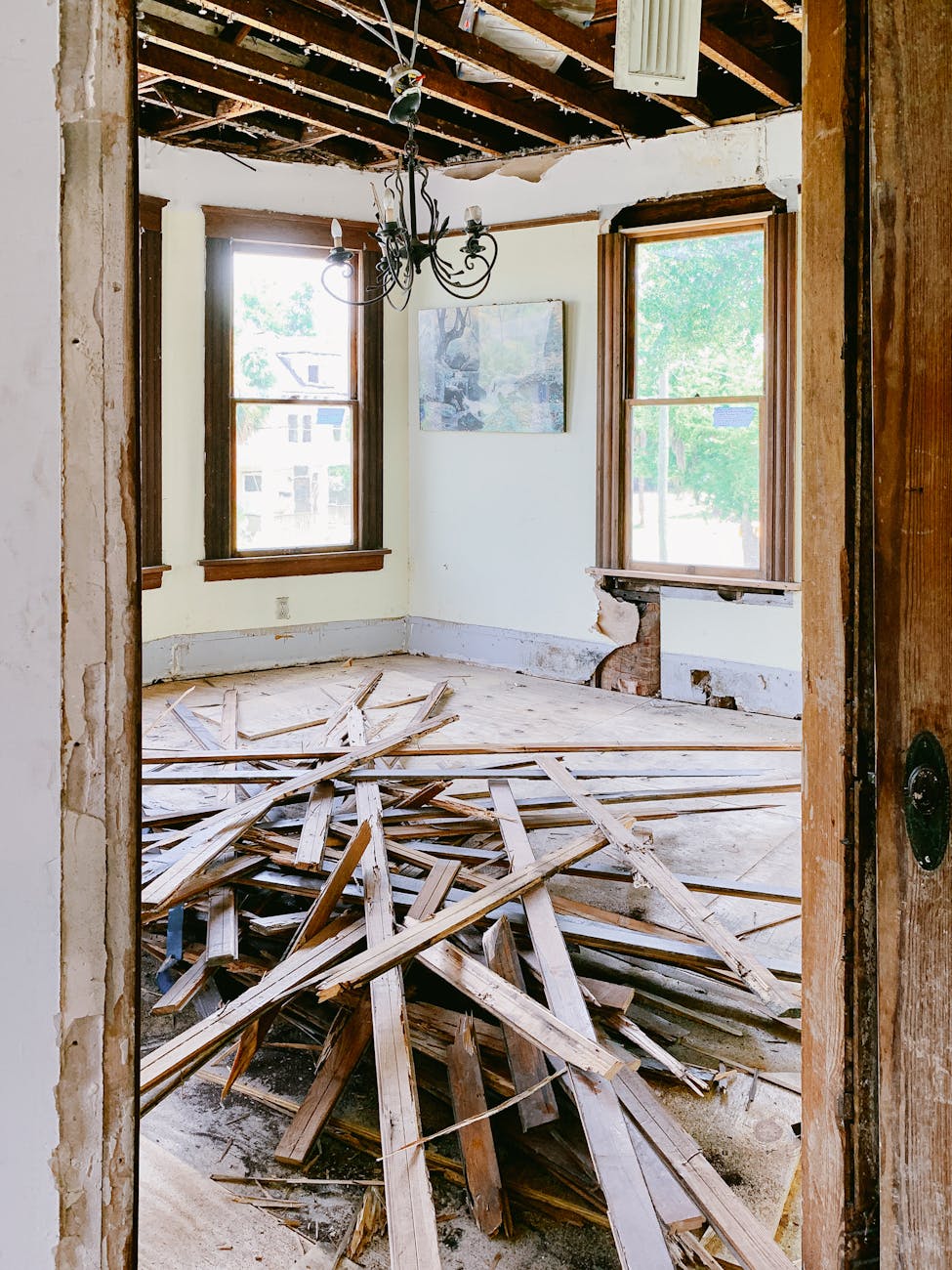 wooden planks on the floor in a house during demolition DIY Disasters and How to Avoid Them