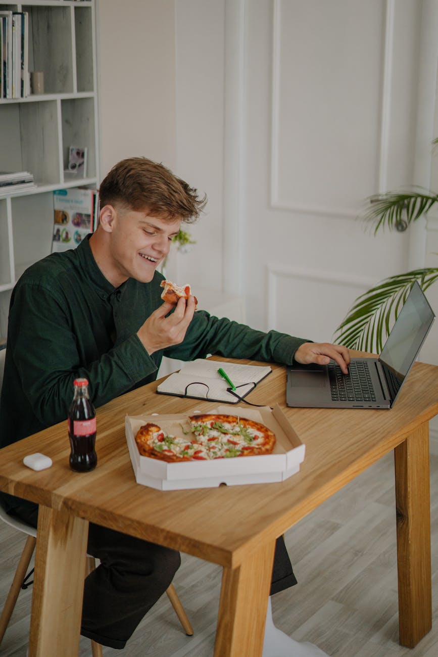 man in green long sleeves shirt smiling