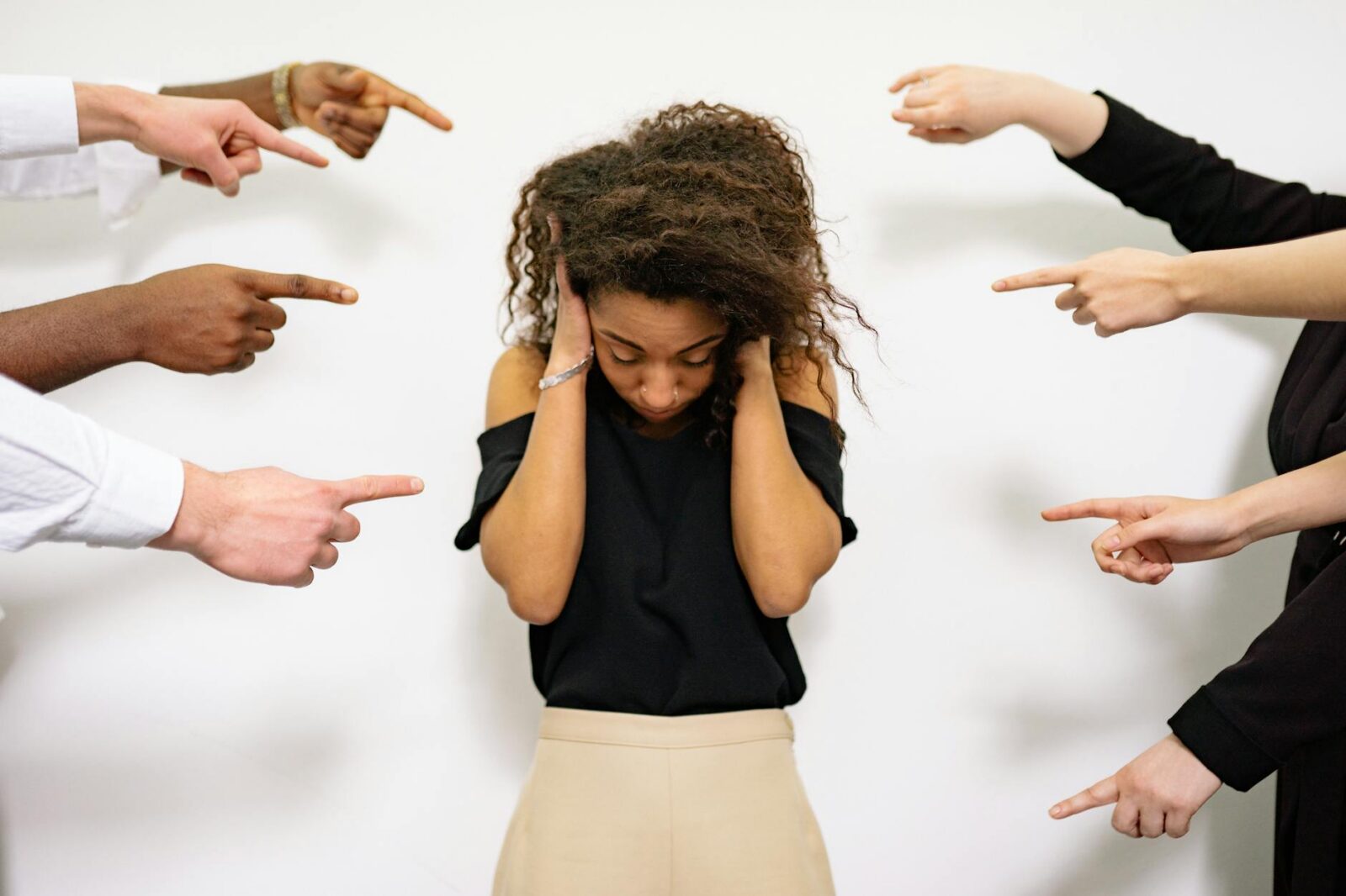 a woman covering her ears 3 Stressful Life Situations When You Need a Lawyer (and Why It Pays Off)