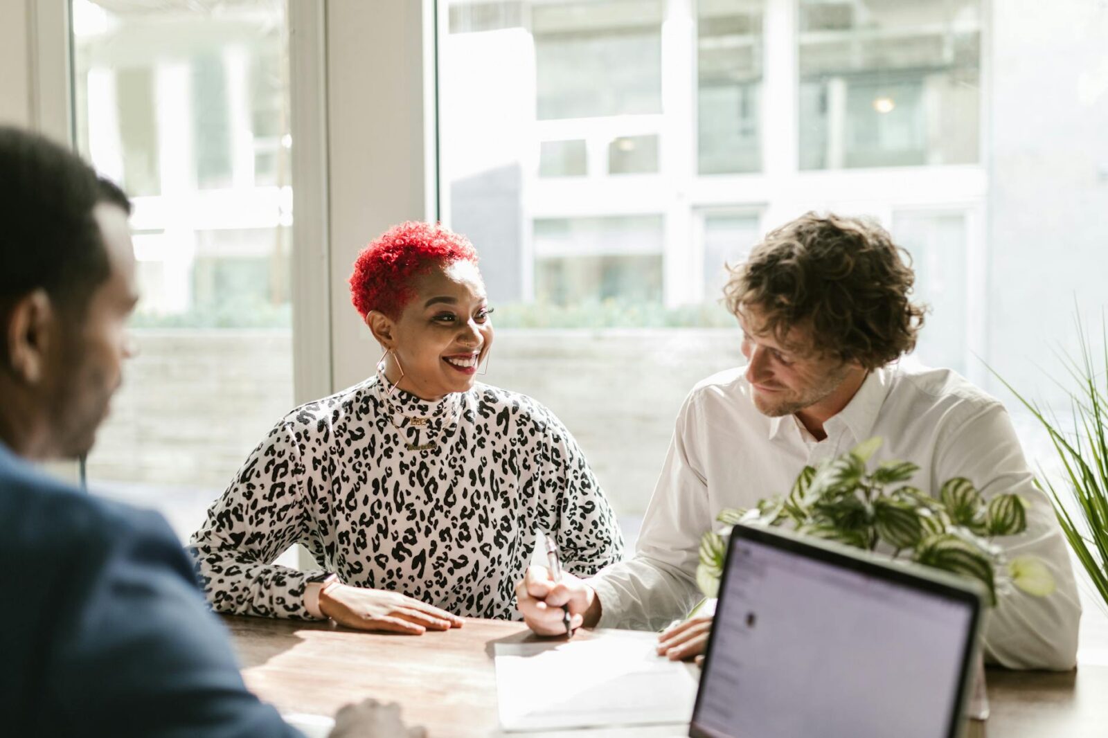 man in black and white long sleeve shirt sitting beside woman in white long sleeve shirt 6 Ways Preventative Maintenance Saves Your Business Money