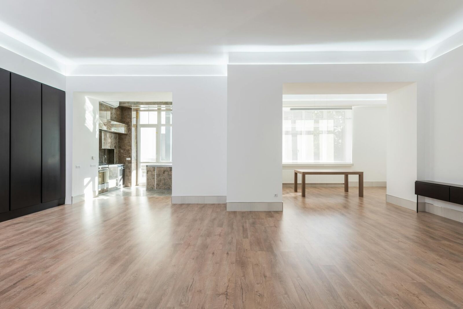 brown wooden table near white wall Landlord Diaries: Is Passive Income Ever Really Passive?