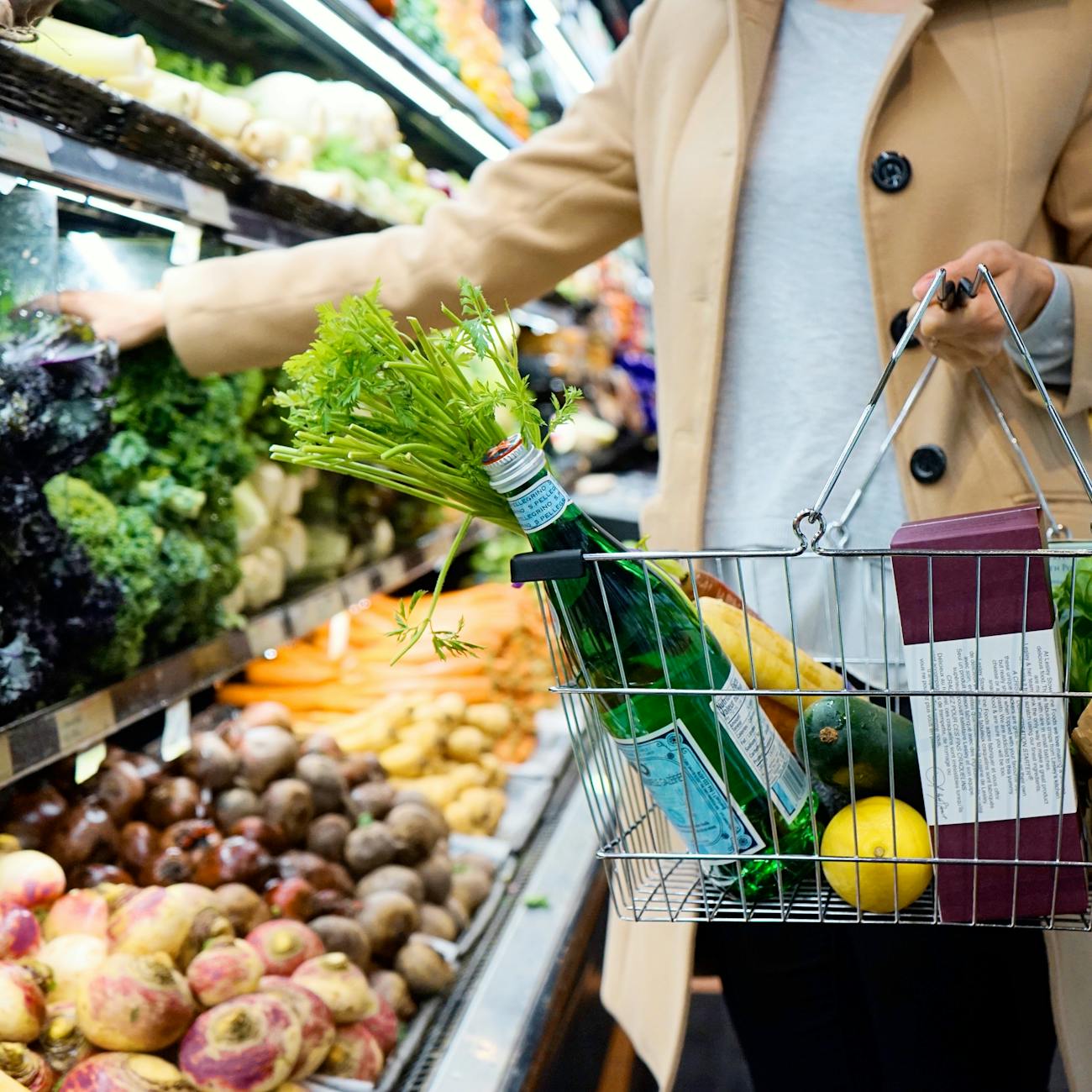 a person holding a basket Shaving Dollars From Your Grocery Bills: Shopping Tips to Save Money