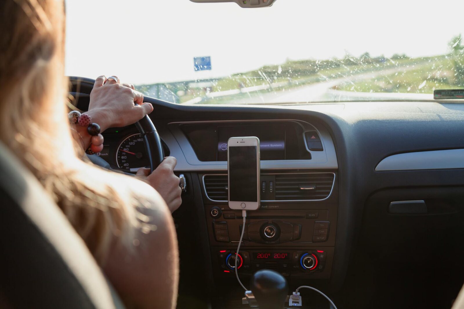 photo of person driving The Pros and Cons of Rideshare Services