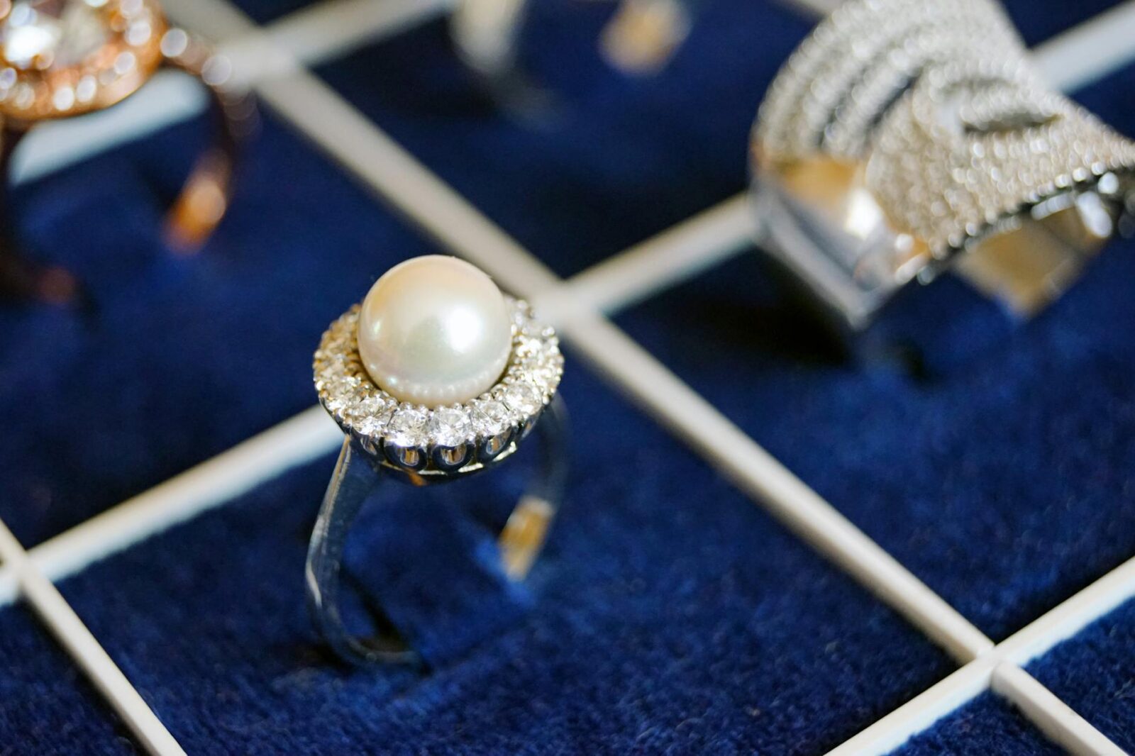 white pearl ring on blue surface 5 Best Diamond Jewelry Websites Reviewed 2025