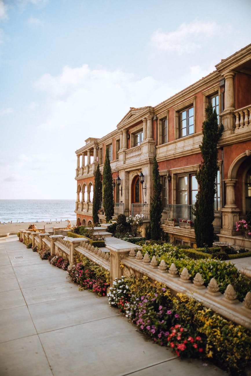 brown building near body of water What Makes a Market “Elite”: High-End Vacation Rental Investment Hubs