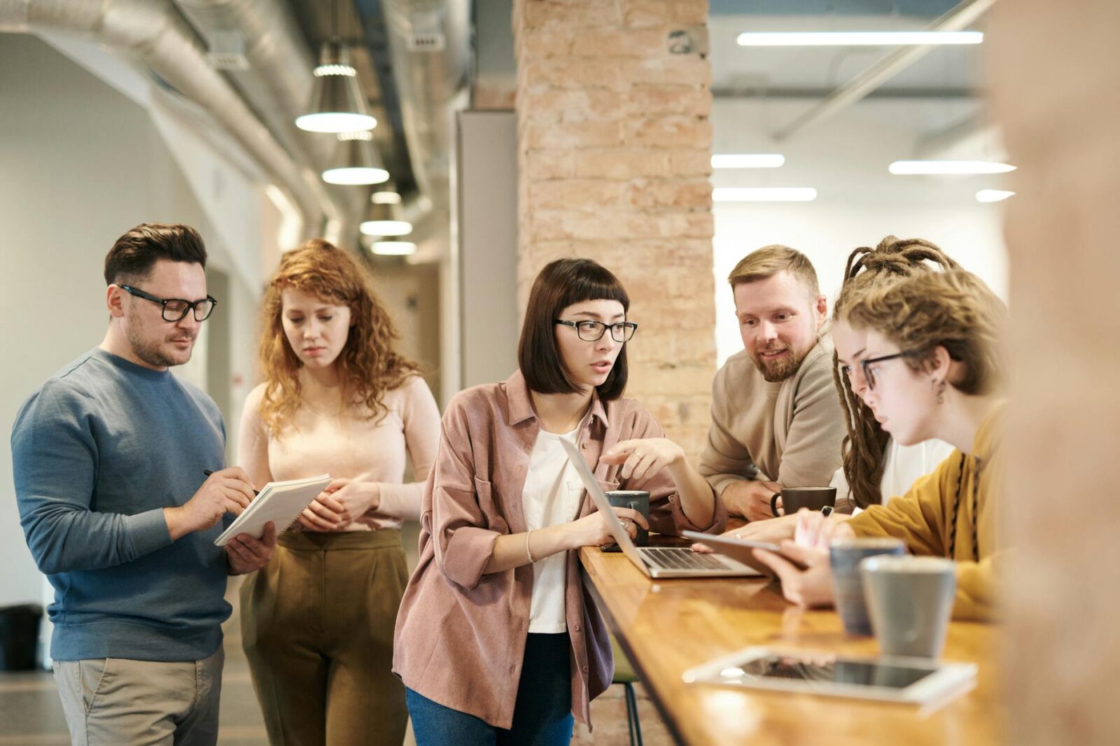 shallow focus photo of people discussing What You Need to Know Before Hiring Family Members