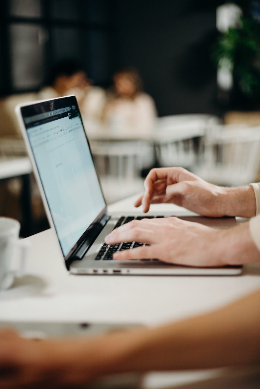 person using laptop computer Why Email Security Still Gets Overlooked (And What To Fix Today)