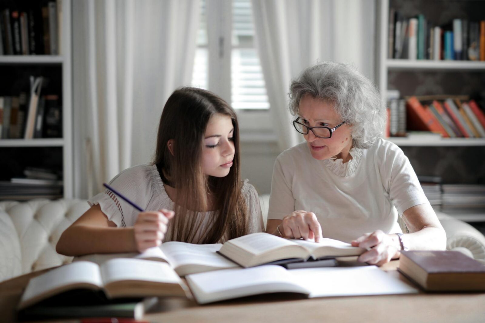 photo of woman talking with another woman Are You Looking For Higher Income As A Teacher?