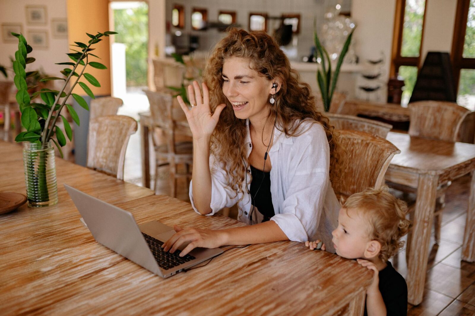 son watching his mom having a video call Why Virtual Meetings Are a Game-Changer for Real Estate Efficiency